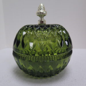 green glass dish with lid and metal acorn shaped handle