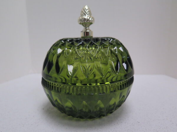 green glass dish with lid and metal acorn shaped handle