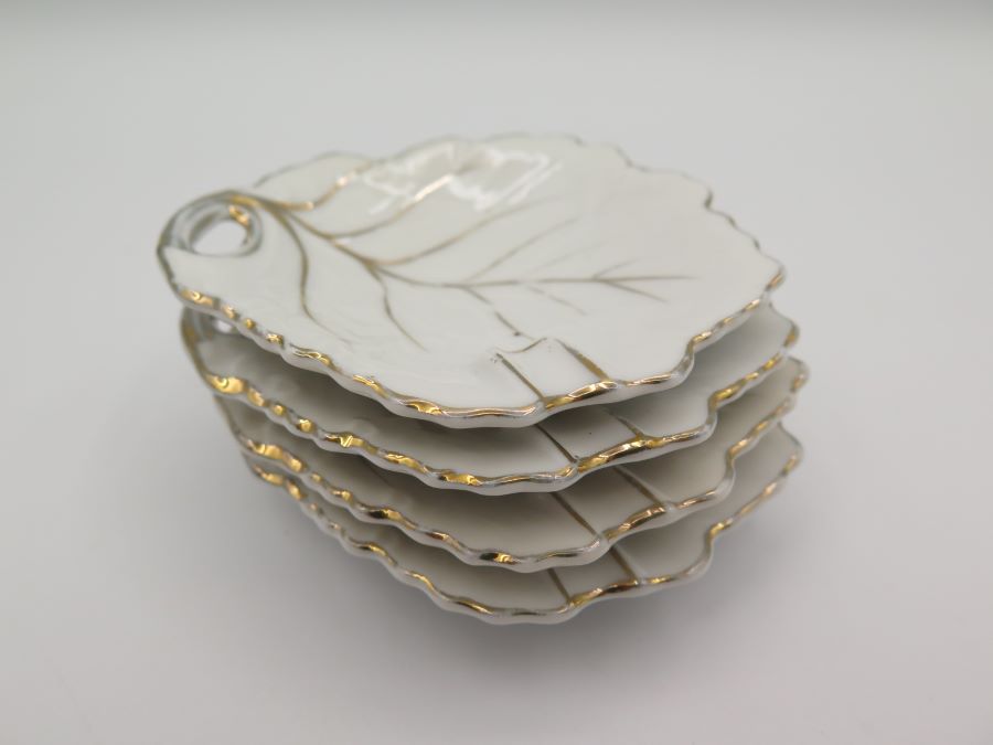 four ceramic ashtrays