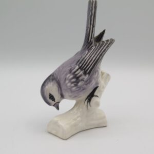 ceramic bird on a branch