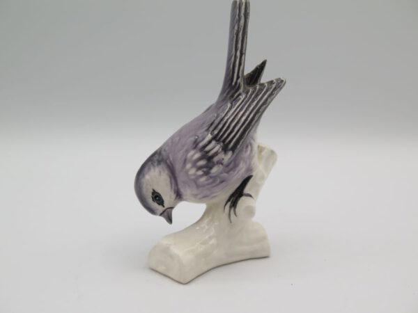 ceramic bird on a branch