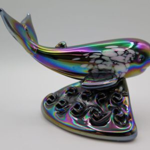 glass figurine of whale on water