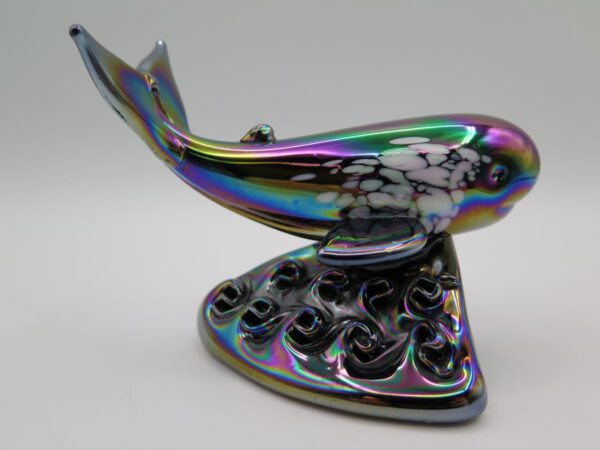 glass figurine of whale on water
