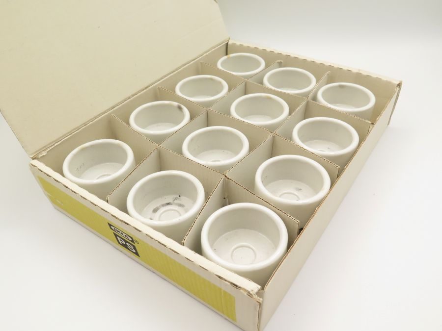12 candle holders in a box