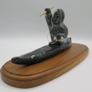 soapstone carving hunter in kayak