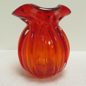orange glass vase, round with frilled top edge