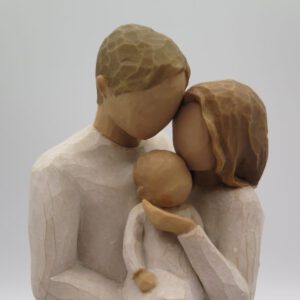 figurine of couple with newborn